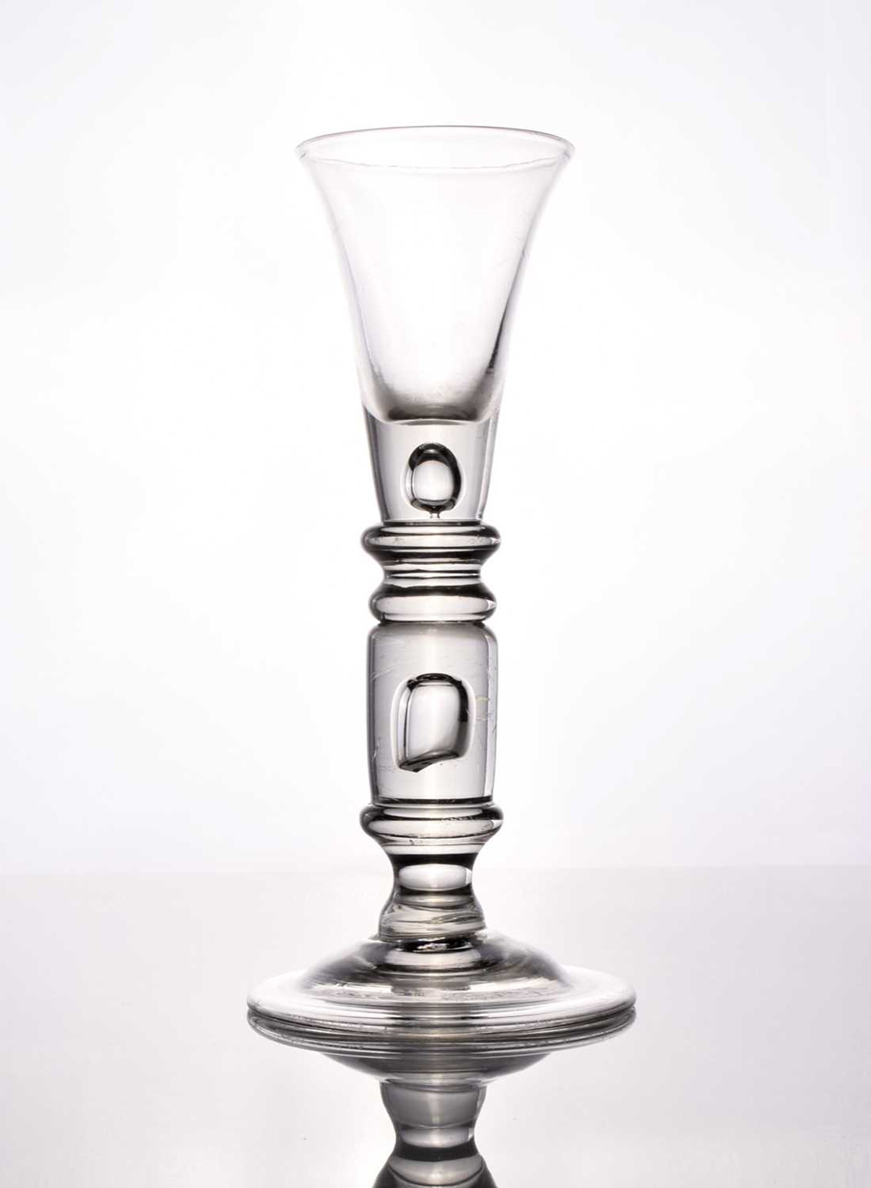 A rare and large cylinder-knopped baluster wine glass, circa 1720 Halls Fine Art Shrewsbury